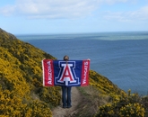 Taylor Fitzgerald, a finance major, strikes a pose with the UA flag along the seaside in the Netherlands. Taylor Fitzgerald, a finance major, strikes a pose with the UA flag along the seaside in the Netherlands.